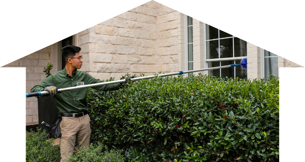 pest control technician doing home pest control services